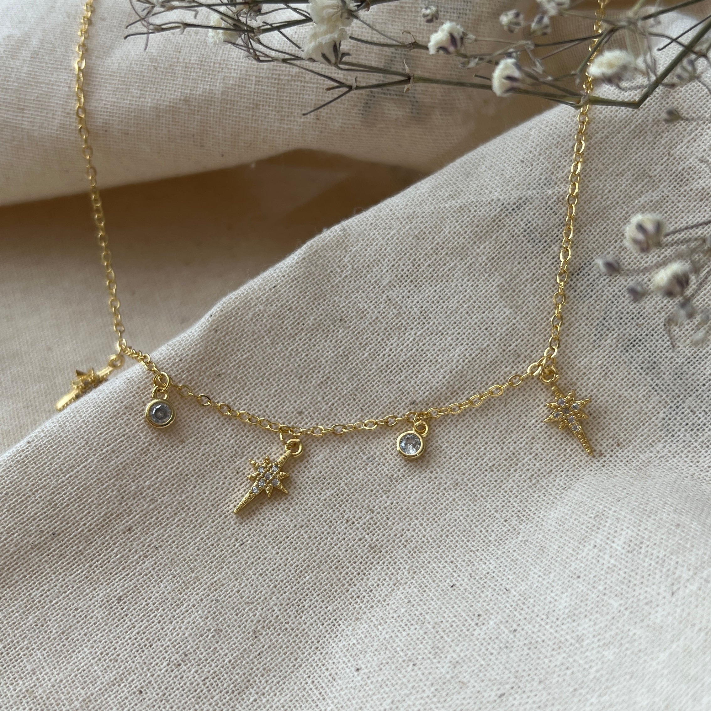 Collar estrellas polares y circones oro