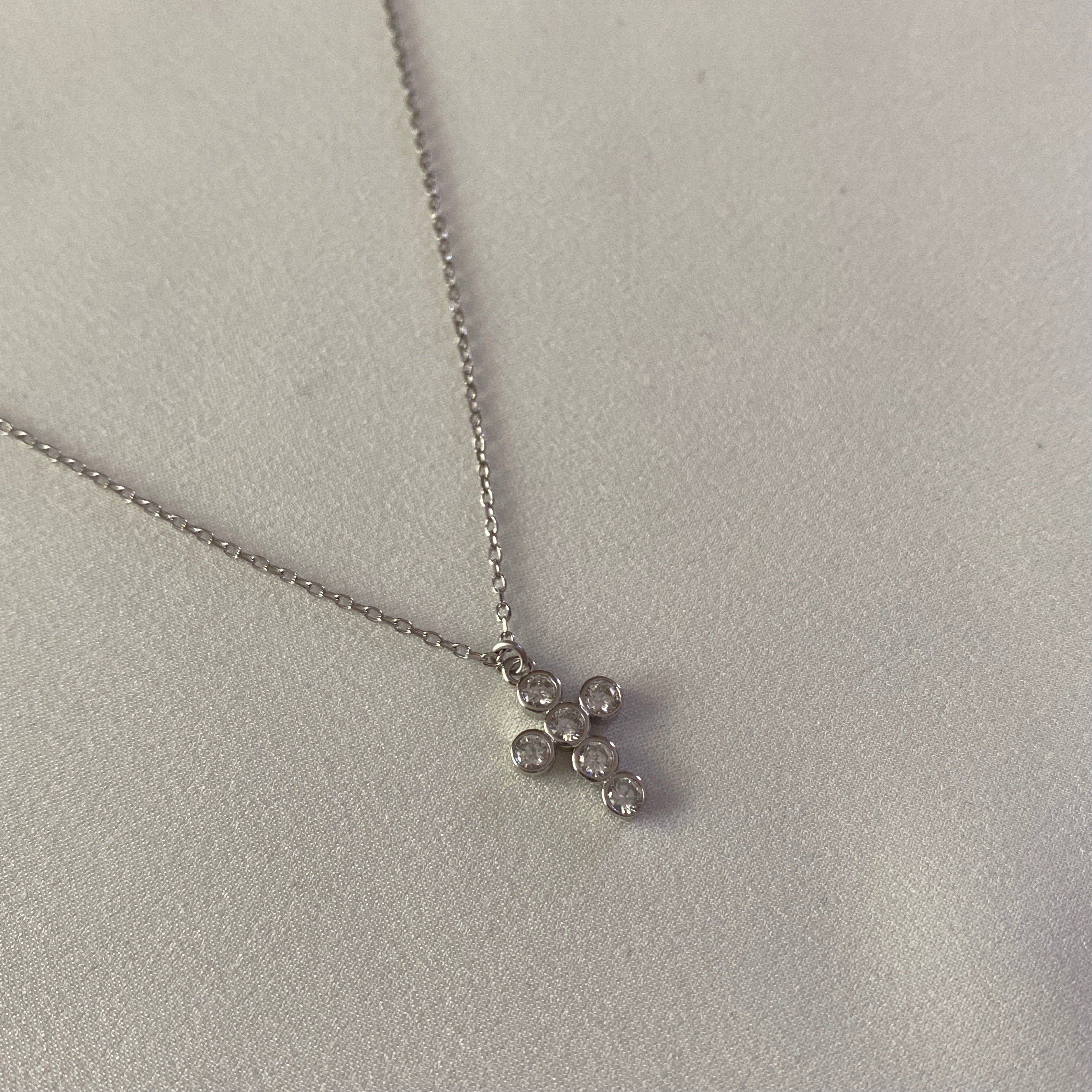 Cruz circones blancos Plata