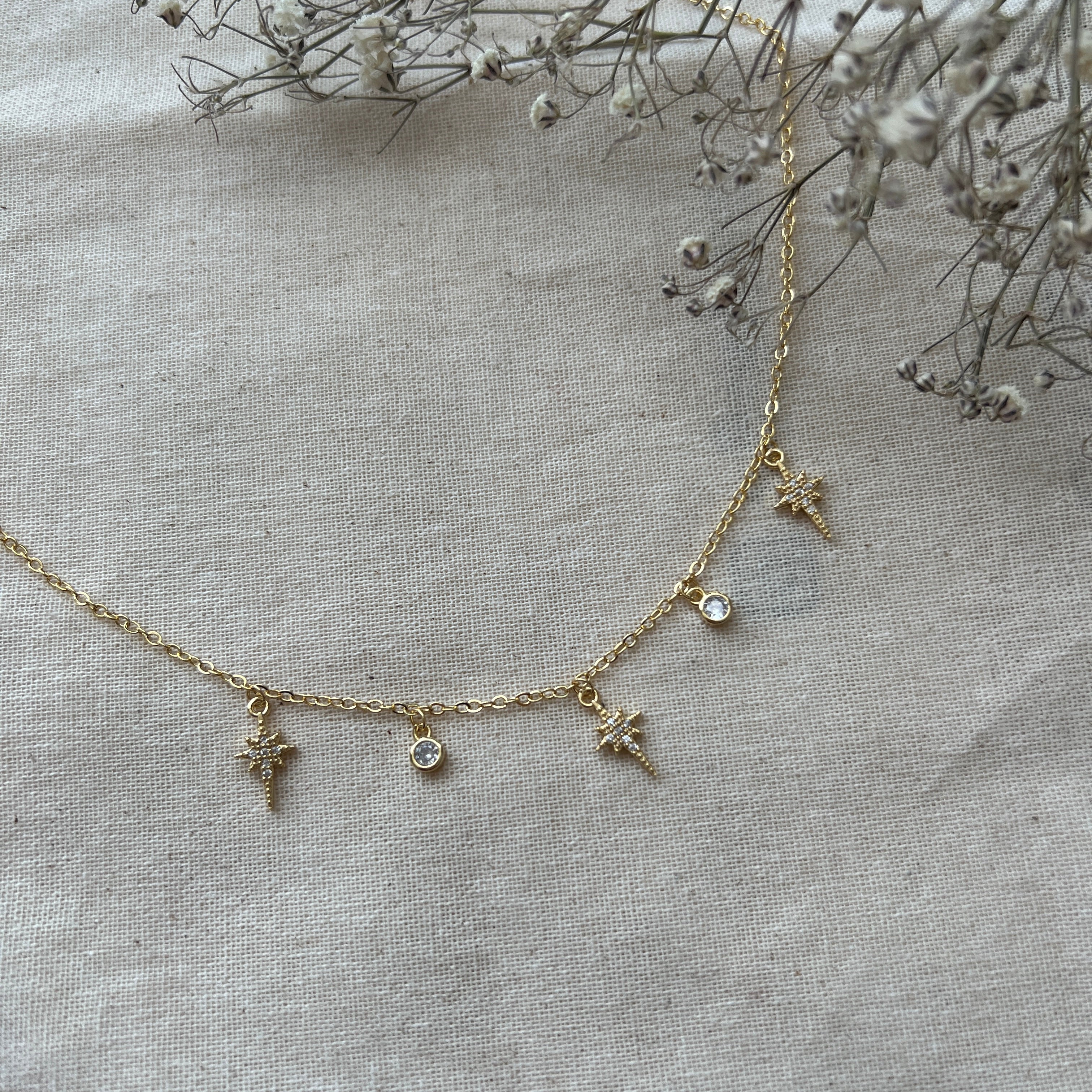 Collar estrellas polares y circones oro